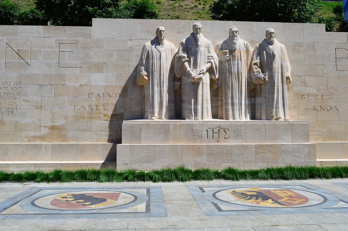 The Reformation Wall with its four large statues of the reformers standing in front of the stone panels
