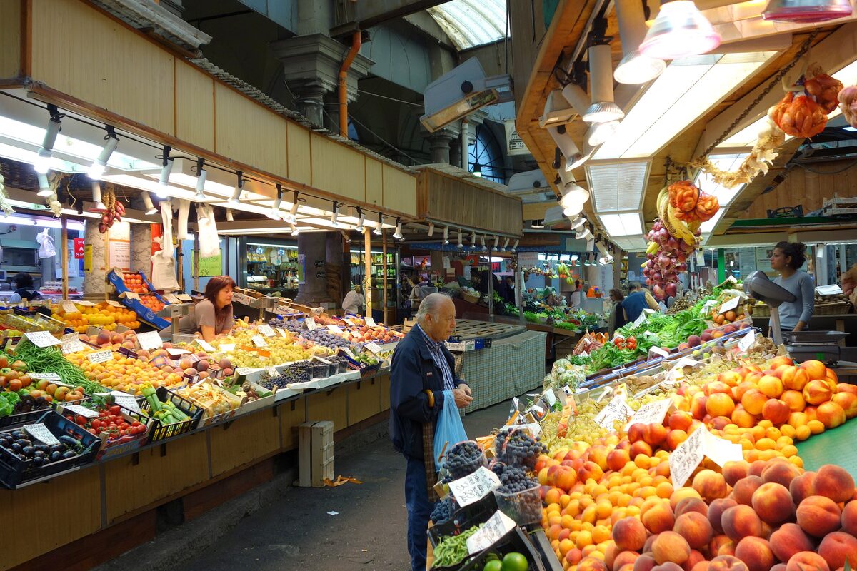 Fruit and vegetable stalls inside the covered Mercato Orientale