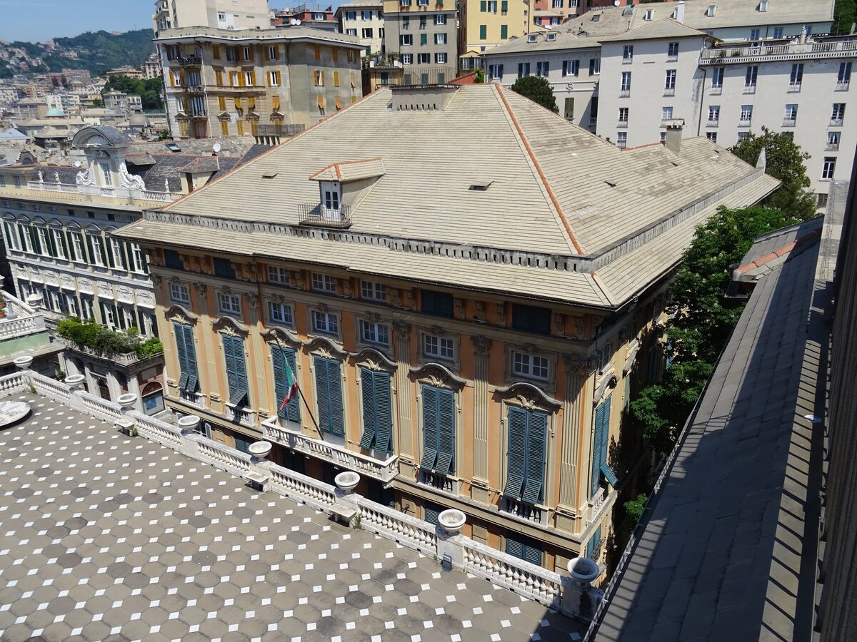 Palazzo Bianco seen from above, with its painted facade and wide roof