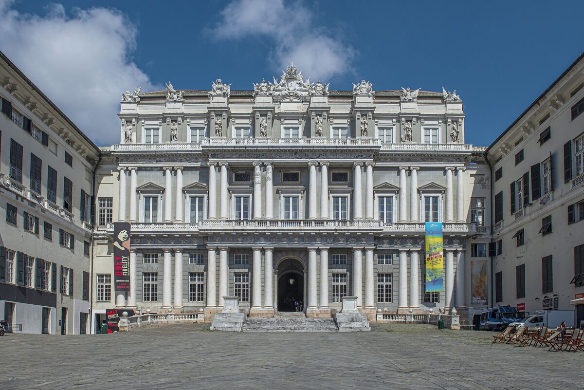 The white columned facade of Palazzo Ducale on its square