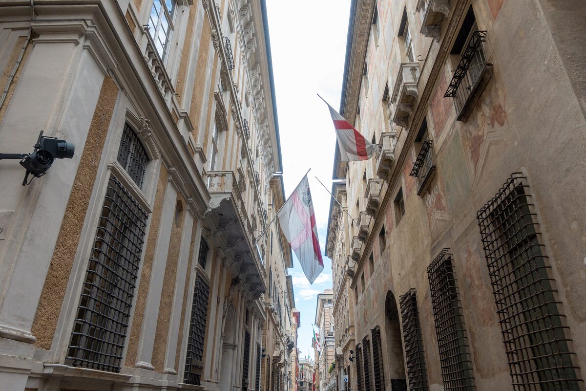 A narrow stretch of Via Garibaldi between Rolli palaces with painted facades