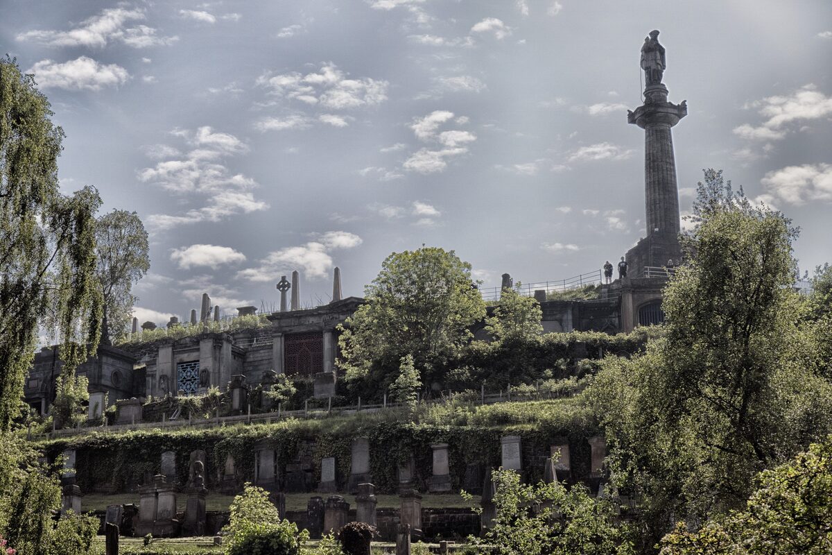 Victorian tombs and monuments on the hill of the Glasgow Necropolis, with the John Knox column on top