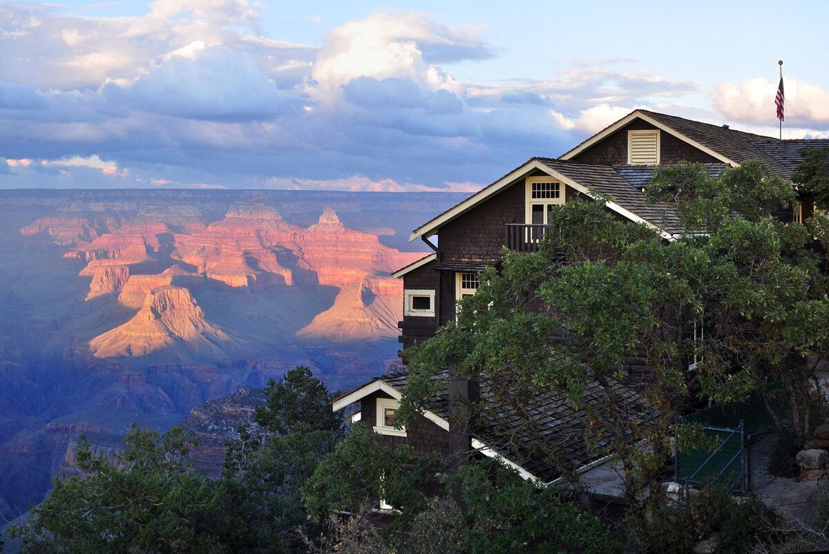 Kolb Studio perched on the rim at sunset with the canyon glowing below