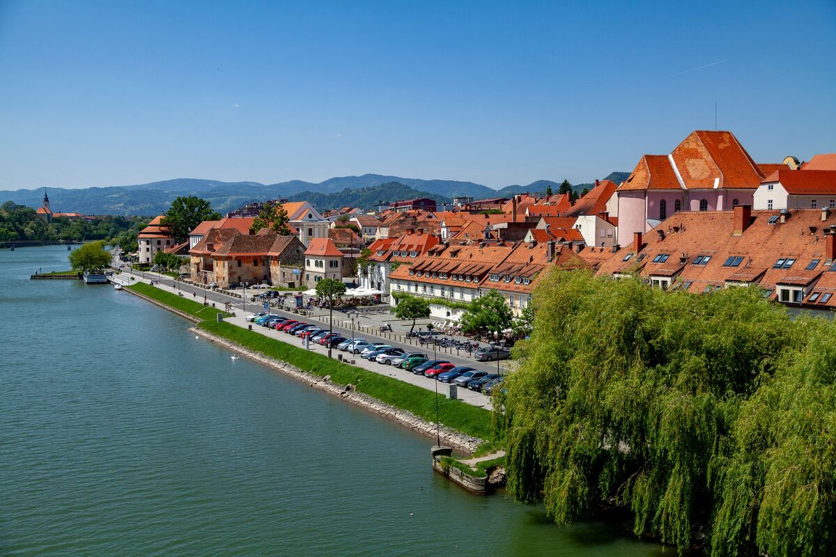 The Drava river and the red roofs of Maribor's old town along the riverbank