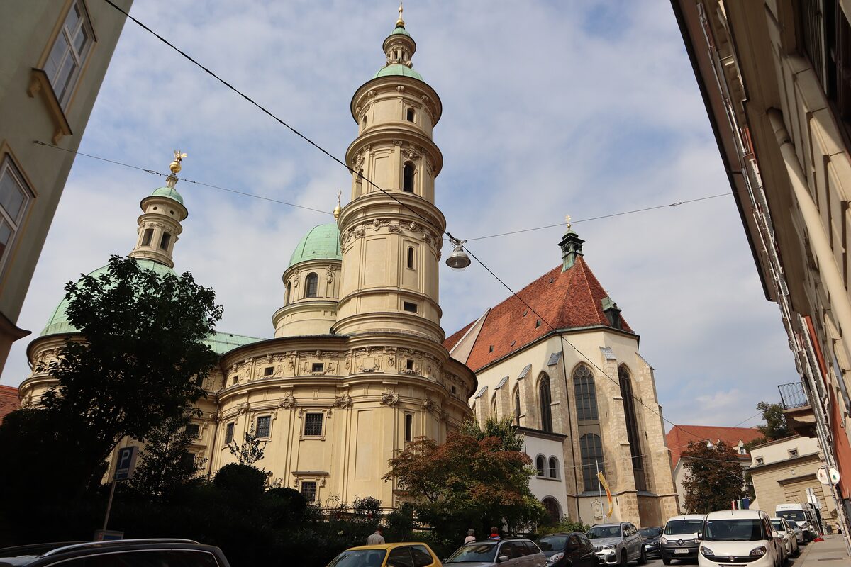 The domes and tower of the Mausoleum of Ferdinand II next to the Gothic gable of Graz Cathedral
