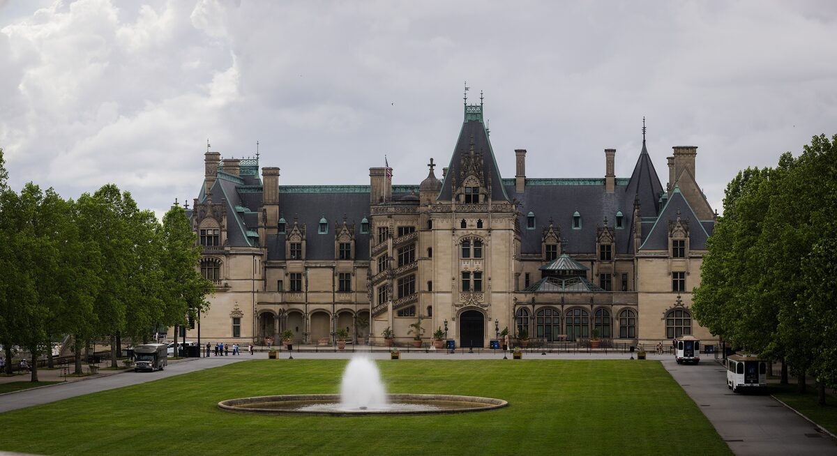 The Biltmore House facade across its lawn and fountain near Asheville
