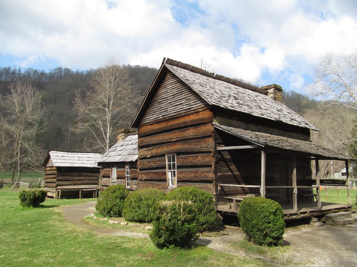 The log farmhouse and outbuildings of the Mountain Farm Museum in spring