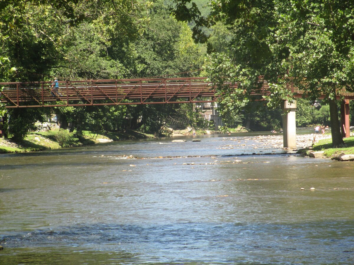 A footbridge across the Oconaluftee River in Cherokee