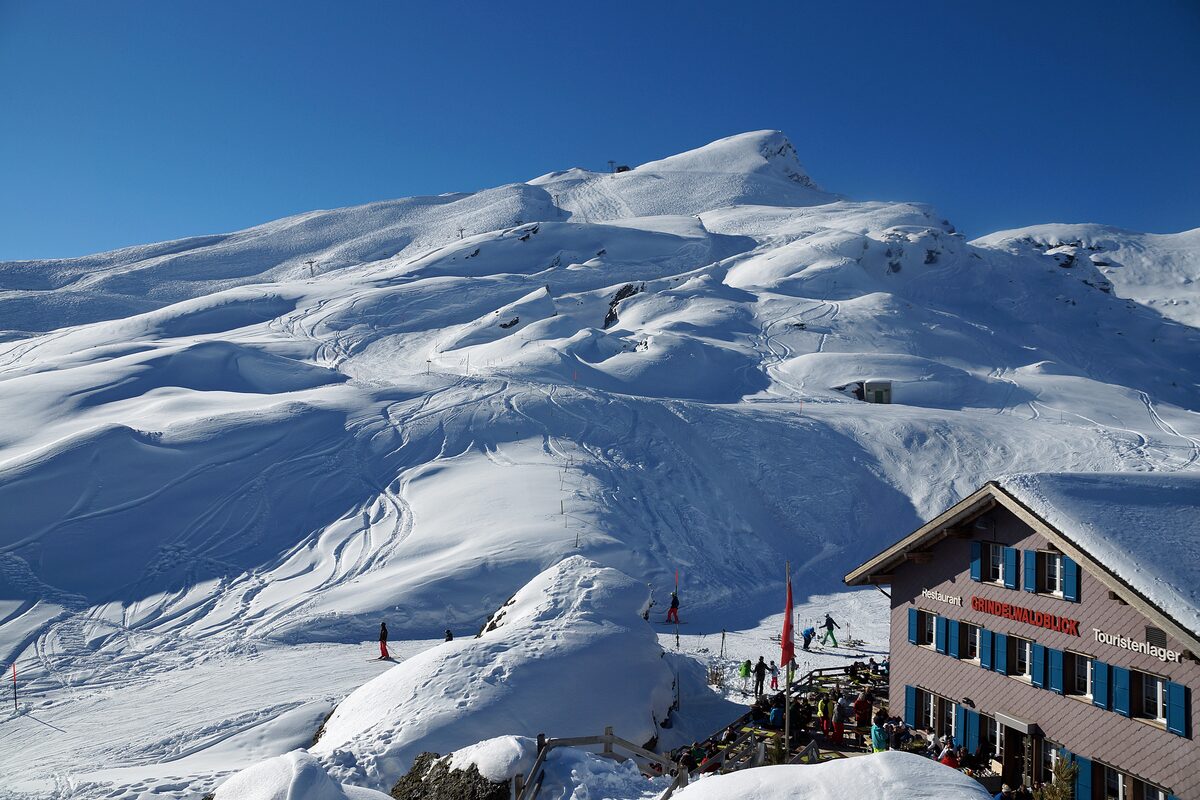 Groomed snow slopes of the Lauberhorn seen from a mountain restaurant