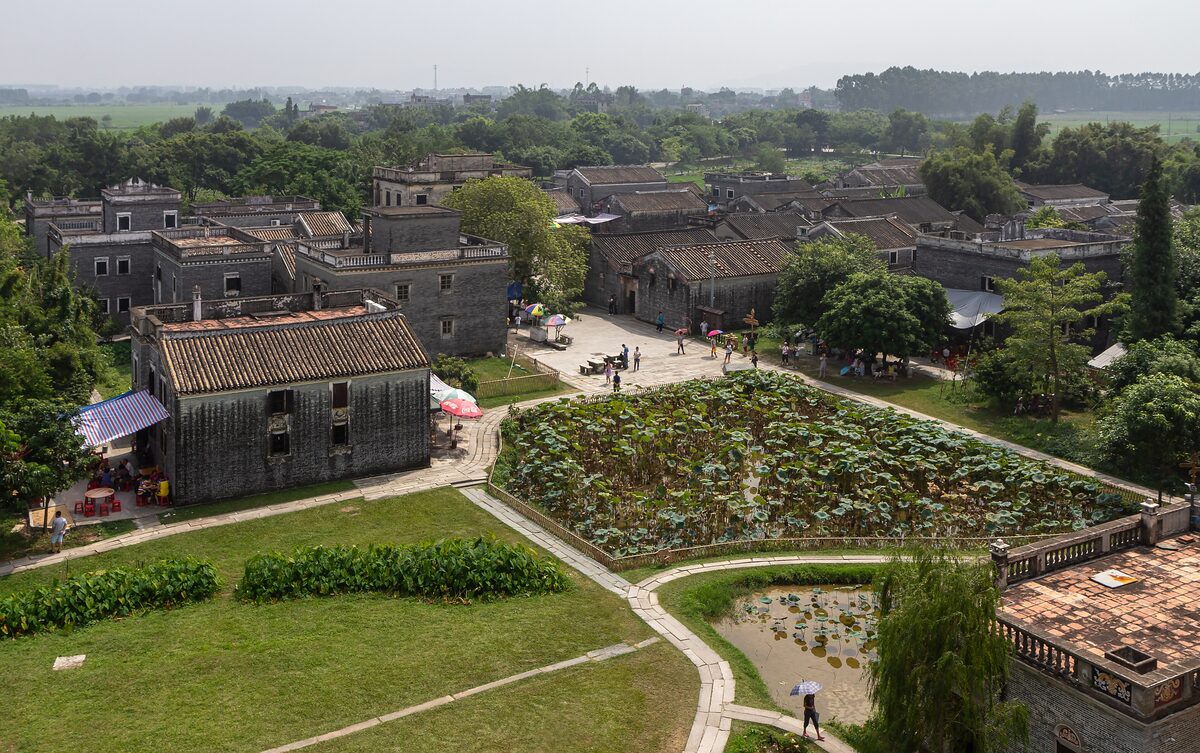 Fortified watchtower houses and a lotus pond in Zili Village near Kaiping, seen from above
