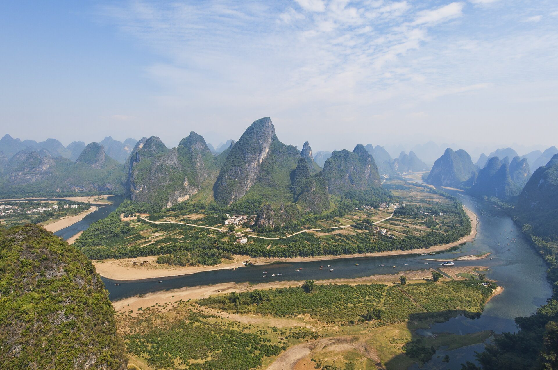Limestone karst peaks and a bend of the Li River seen from a viewpoint near Yangshuo in Guangxi