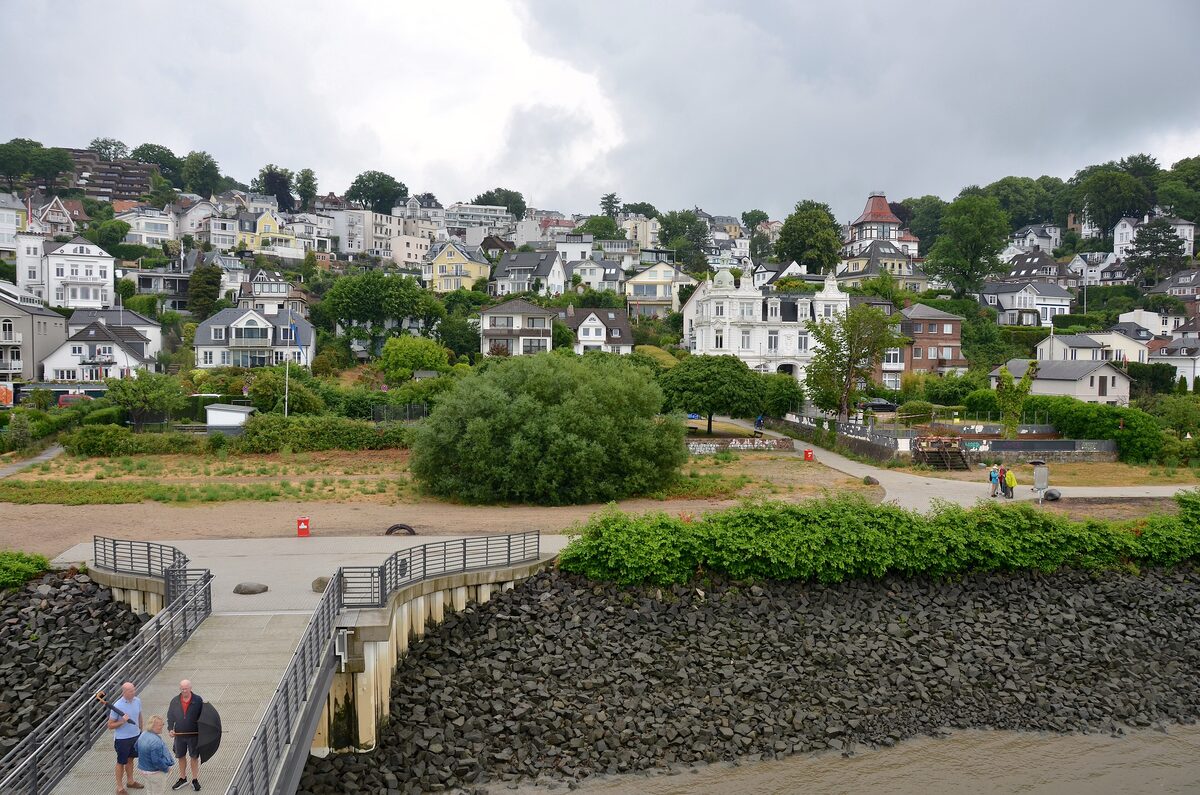 White villas climbing the green hillside of Blankenese above the Elbe shore