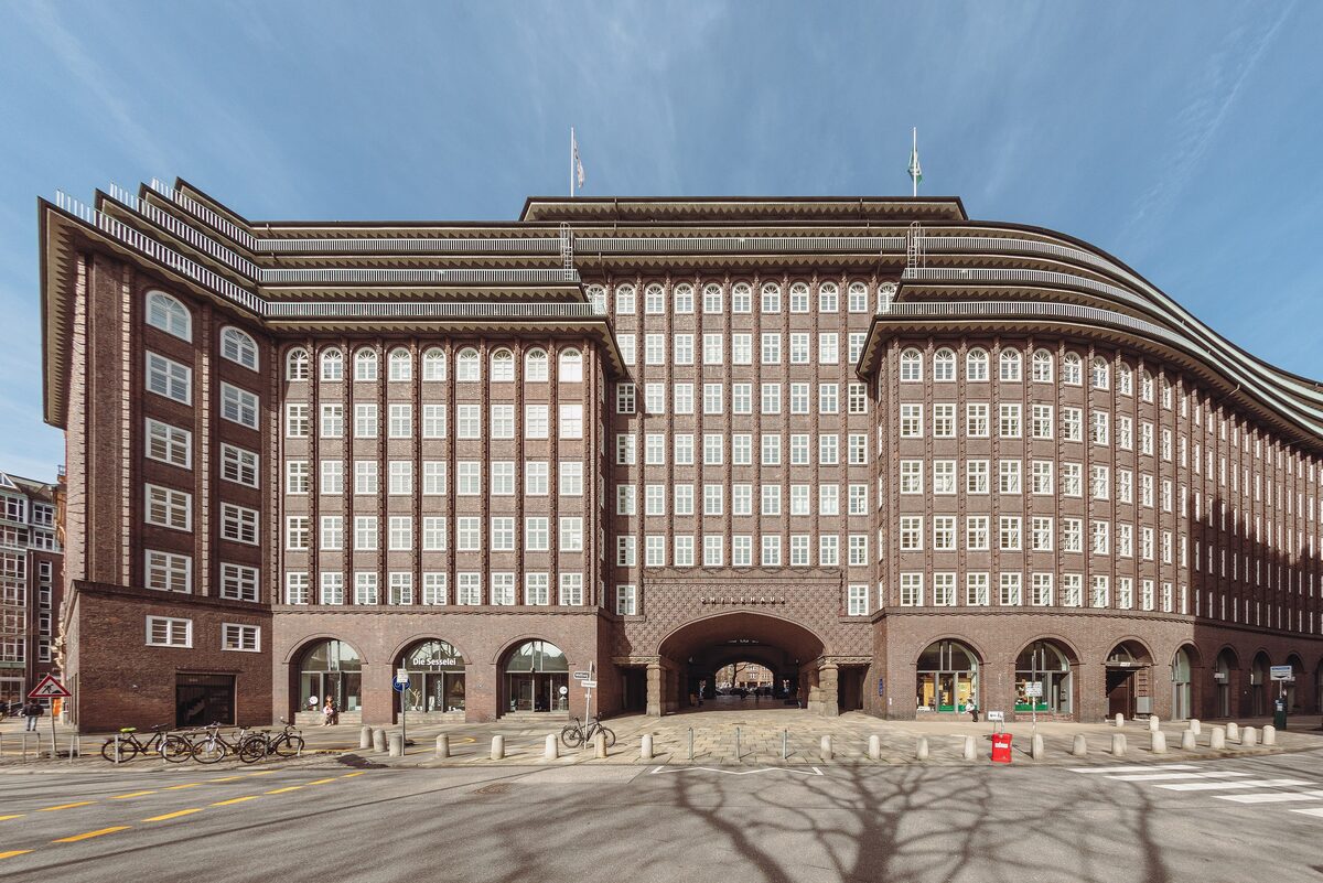 The Chilehaus, a long dark-brick office building with rows of narrow windows and a gate arch at street level