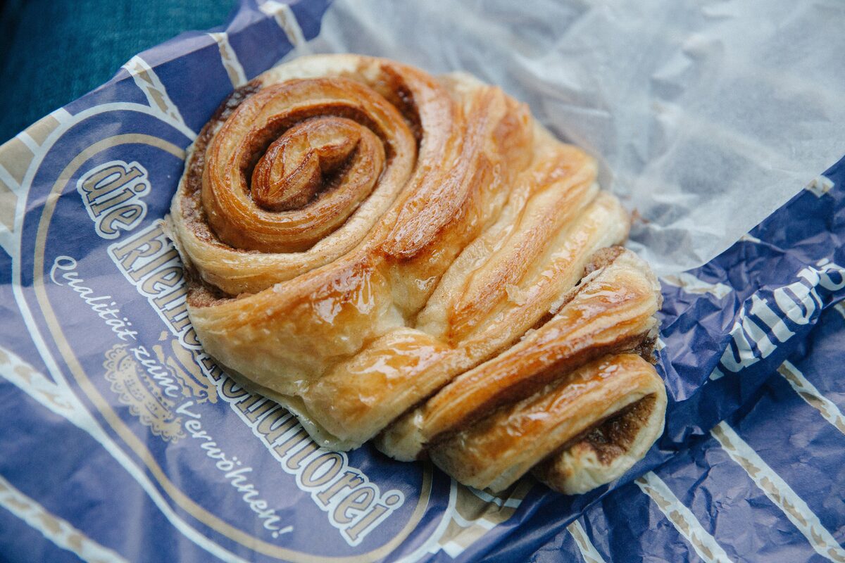 A Franzbrötchen, the flat cinnamon-sugar pastry, on the paper bag of a Hamburg bakery