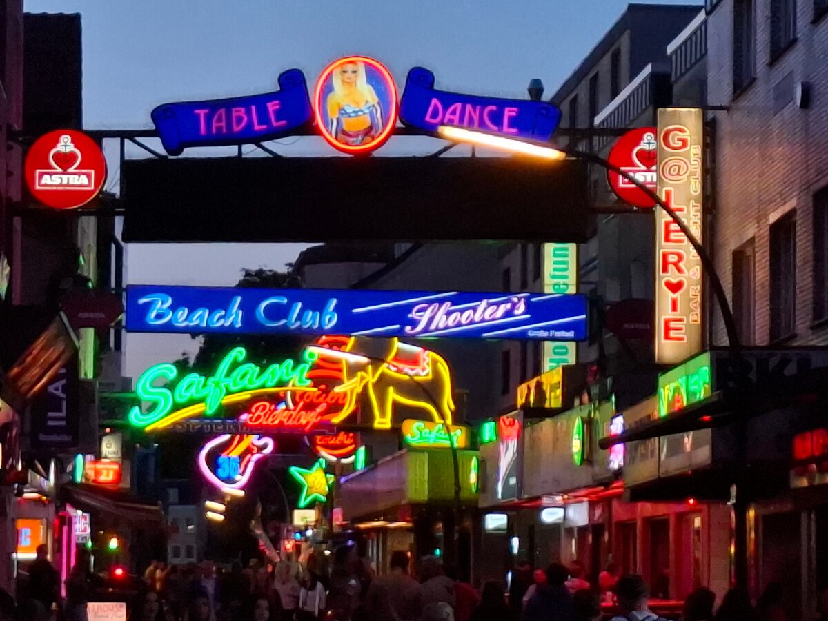 Neon signs over the Große Freiheit, the side street off the Reeperbahn, at dusk