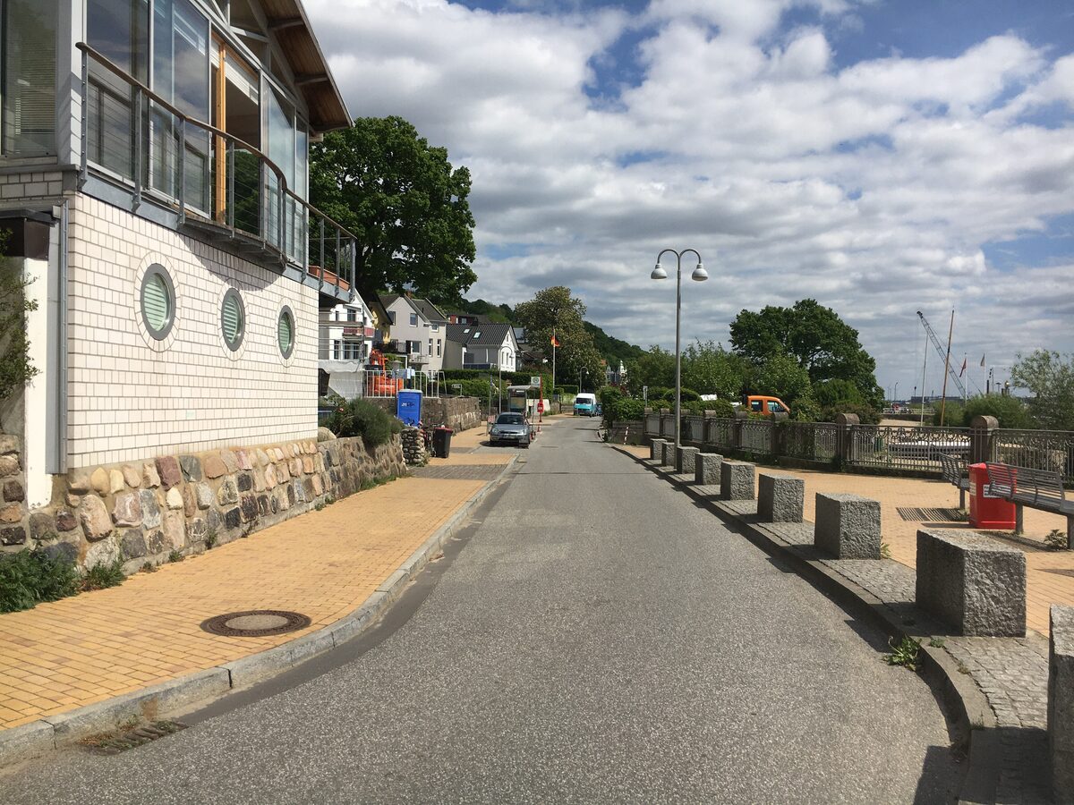 The Strandweg in Blankenese, a quiet lane lined with granite bollards, running along the Elbe