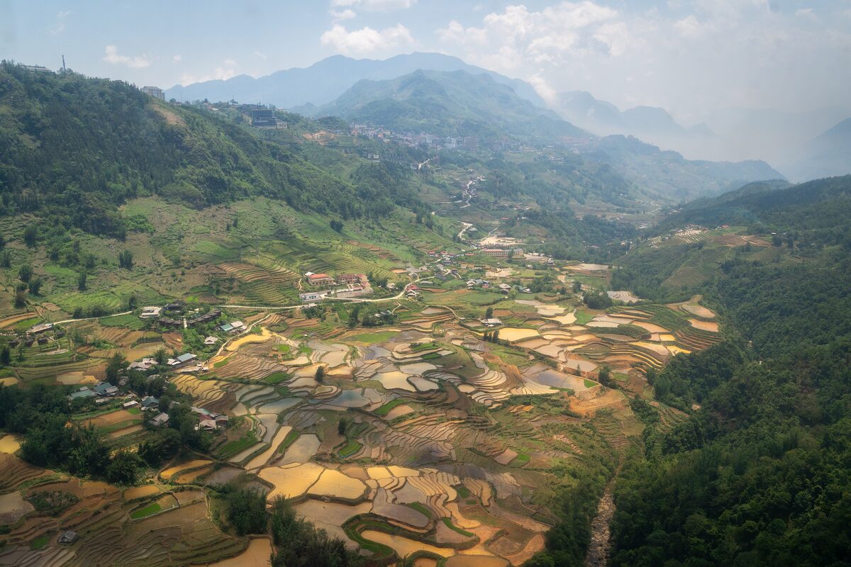 Terraced rice fields in the valleys around Sapa, with misty mountains in the distance