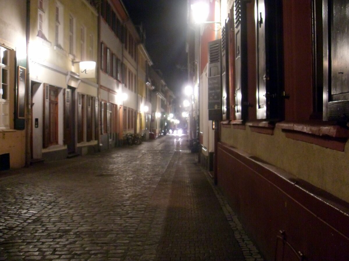 The cobbled Untere Straße in the old town at night, lit by street lamps