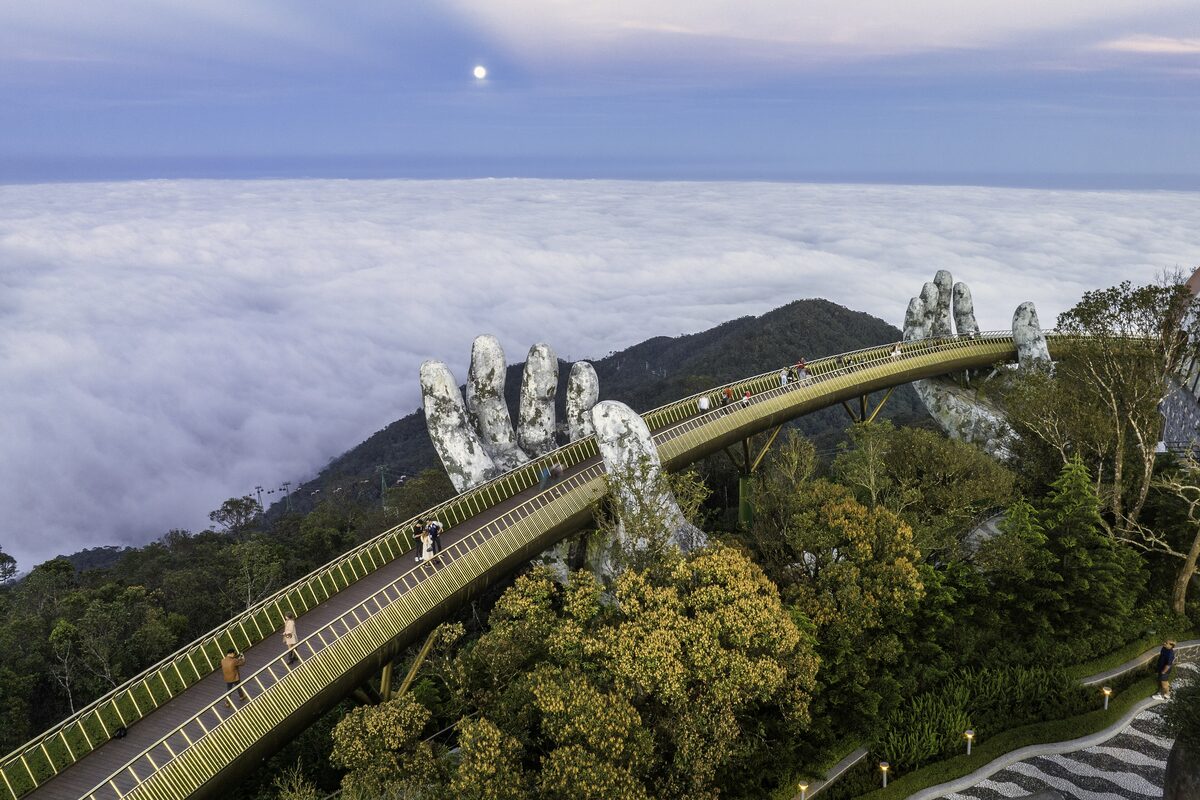 The Golden Bridge in Ba Na Hills, held up by two giant stone hands above the clouds