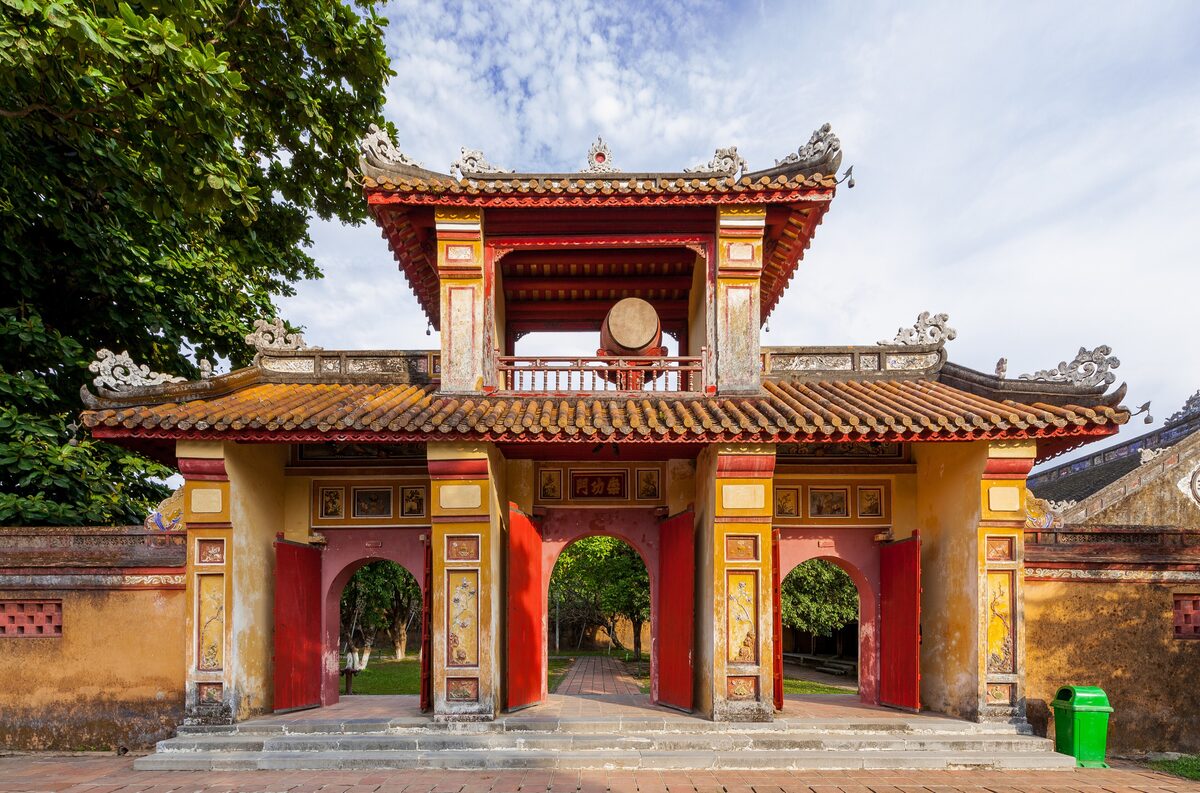 A red and yellow gate of the Imperial City in Hue, with arched passages and a tiled roof