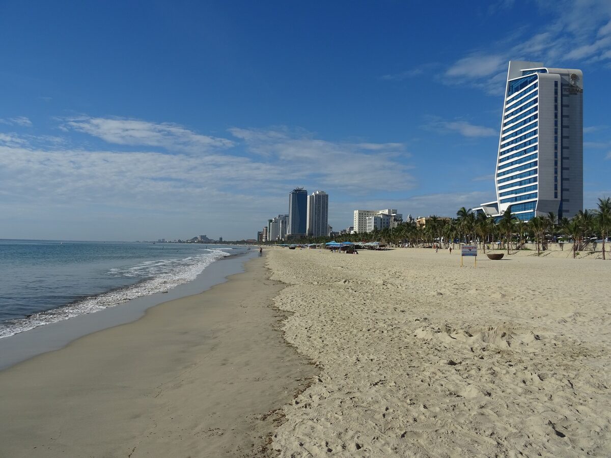 My Khe Beach in Da Nang on a sunny day, with high-rise hotels along the coast