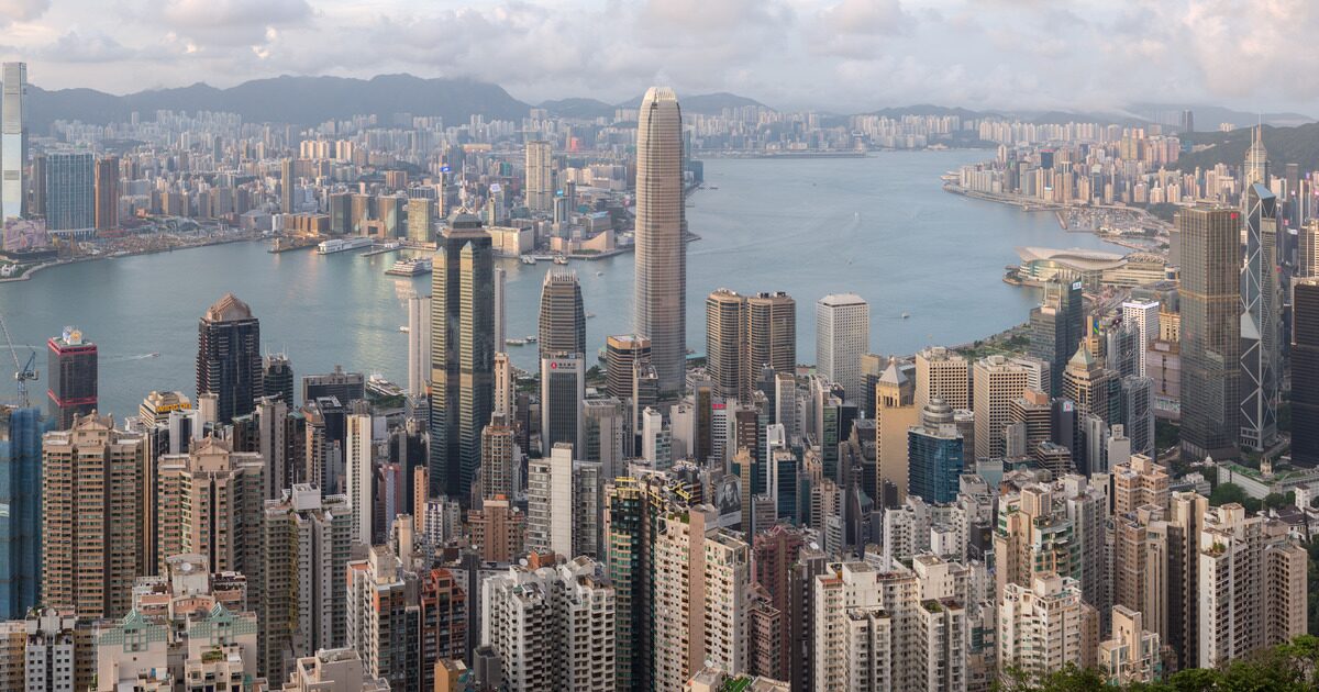 Hong Kong Island towers and Victoria Harbour seen from Lugard Road on Victoria Peak on a soft, hazy day, with Kowloon across the water