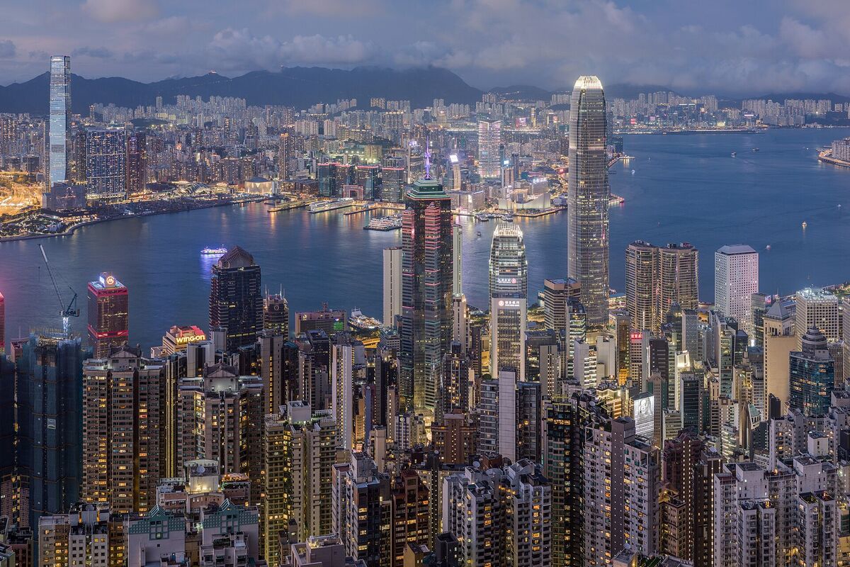 Blue-hour view from Victoria Peak as the lights come on across the towers of Central and Victoria Harbour