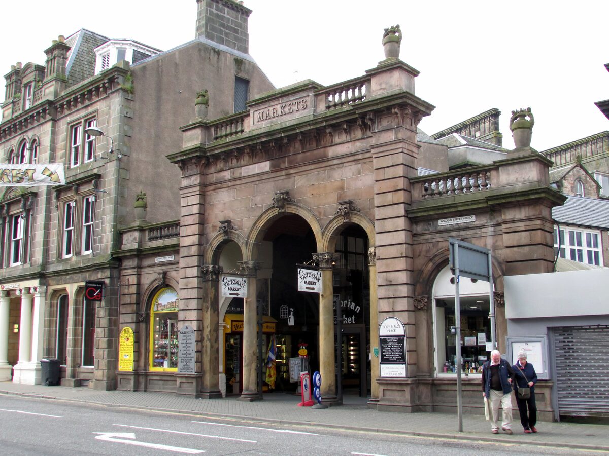 The arched sandstone entrance to the Victorian Market on Academy Street in Inverness