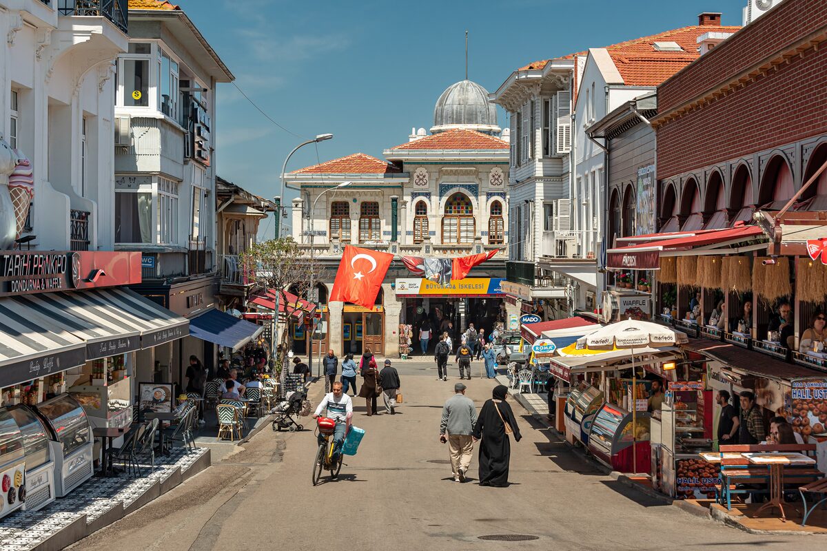 The main street of Büyükada running up from the domed ferry building, lined with cafés and old wooden houses