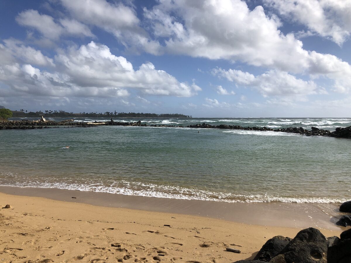Calm protected lagoon and sandy shore at Lydgate Beach Park