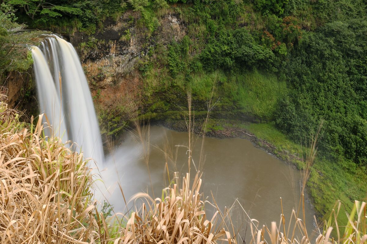 Wailua Falls plunging into a round pool on Kauai