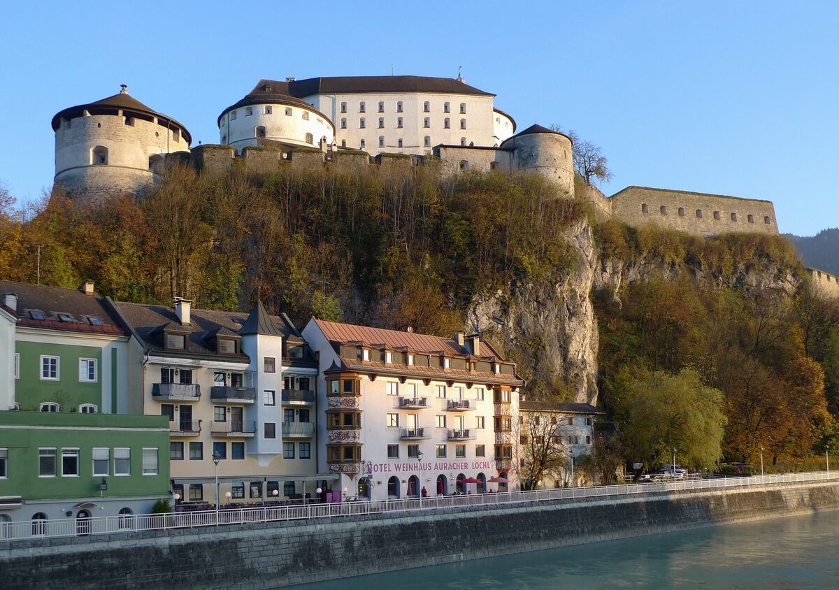 Kufstein Fortress on its rock above the Inn and the houses along the riverbank