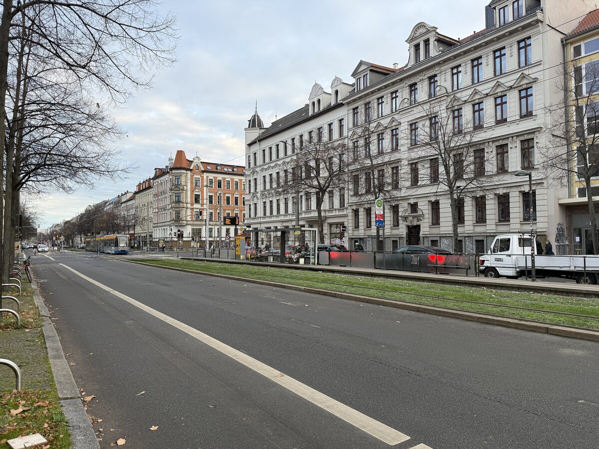 Karl-Liebknecht-Straße with its tram tracks and long rows of tall Gründerzeit apartment buildings