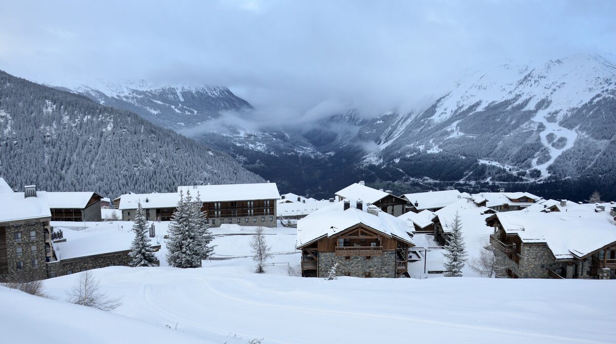 The Les Eucherts village of La Rosière on a snowy morning, with chalets and mountains behind