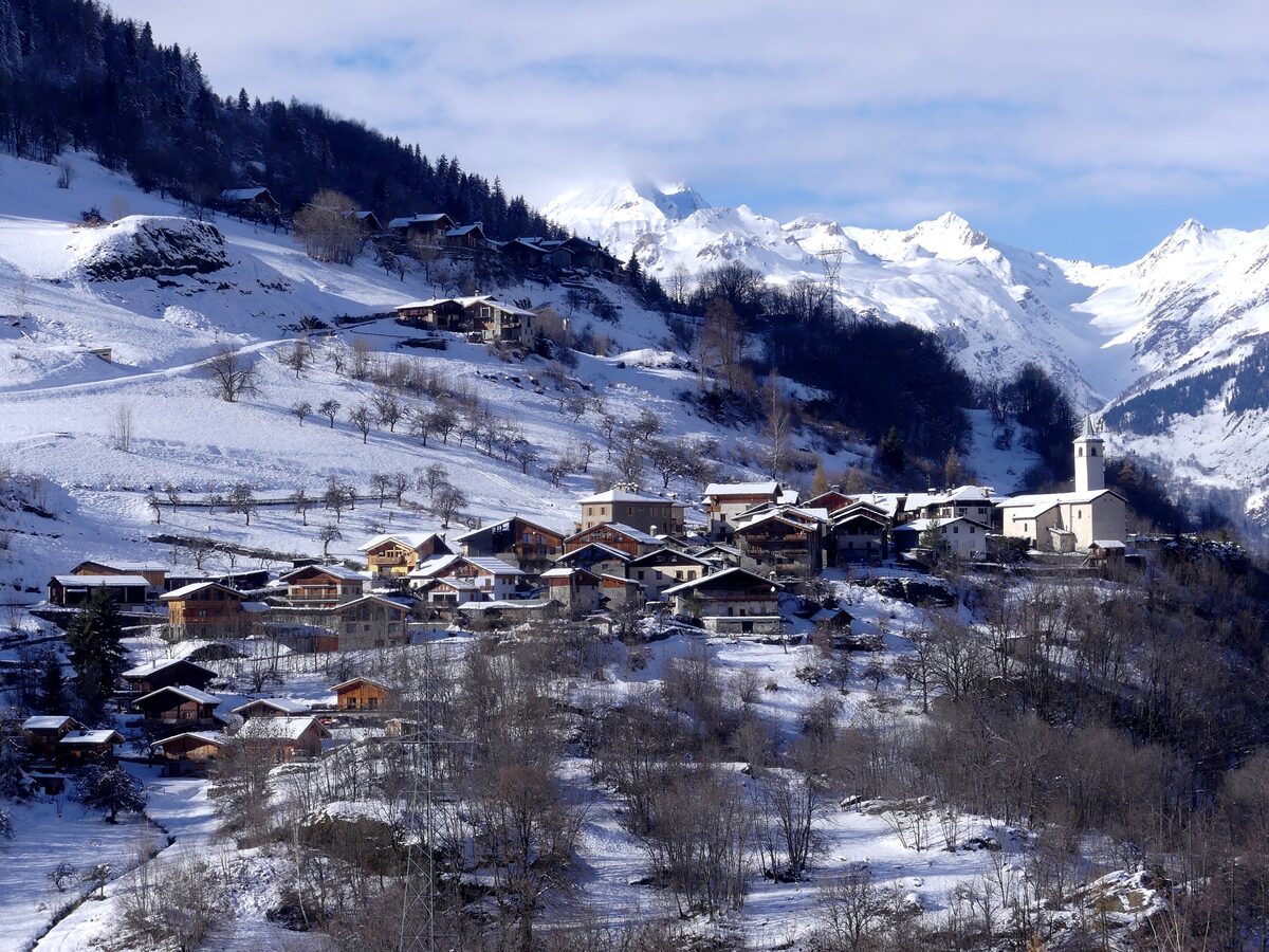 The snow-covered village of Villaroger on its hillside, seen from Sainte-Foy