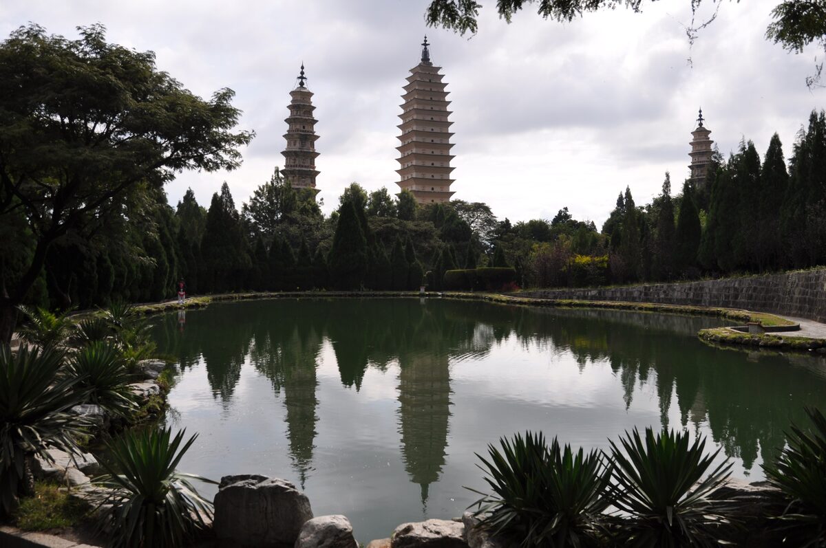 The Three Pagodas of Chongsheng Temple reflected in a pond