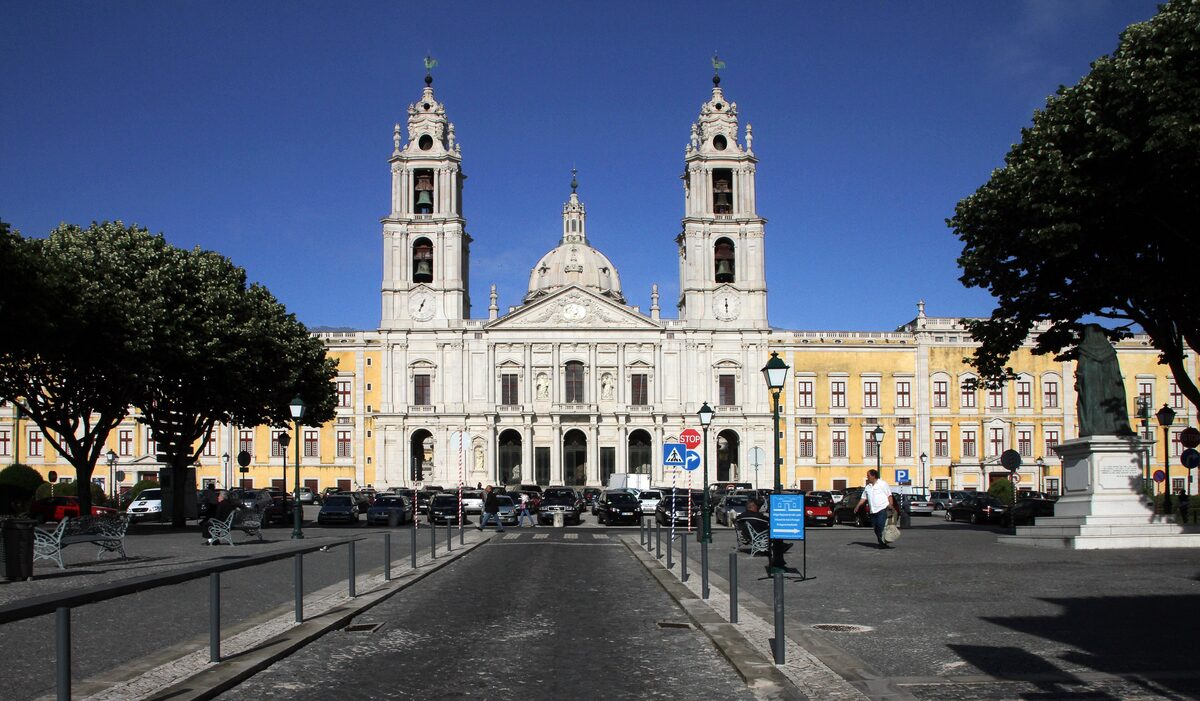 The west facade of the Mafra National Palace with its twin towers and central dome