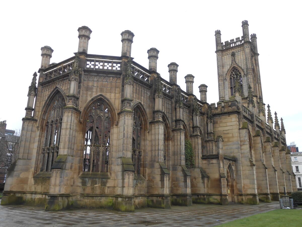 The roofless Gothic ruin of St Luke's Church in Liverpool, with empty windows and trees growing inside the walls