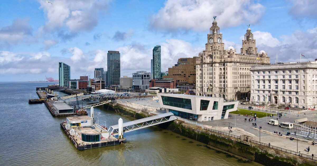 Aerial view of the Liverpool waterfront at Pier Head, with the Royal Liver Building and its clock towers, the ferry terminal and the River Mersey