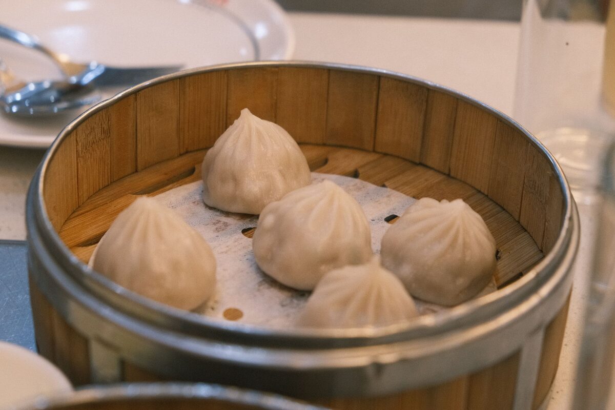 Soup dumplings in a bamboo steamer basket