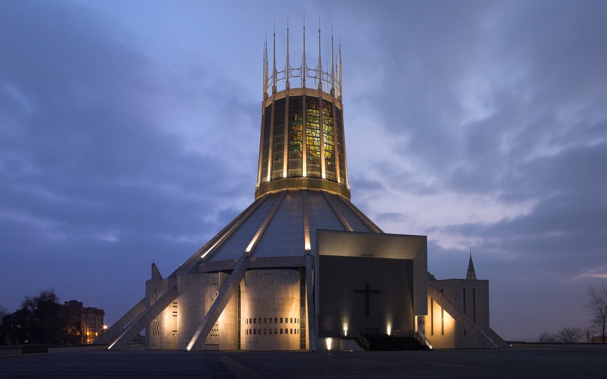 The round, modern Metropolitan Cathedral of Liverpool with its tall lantern tower shaped like a crown