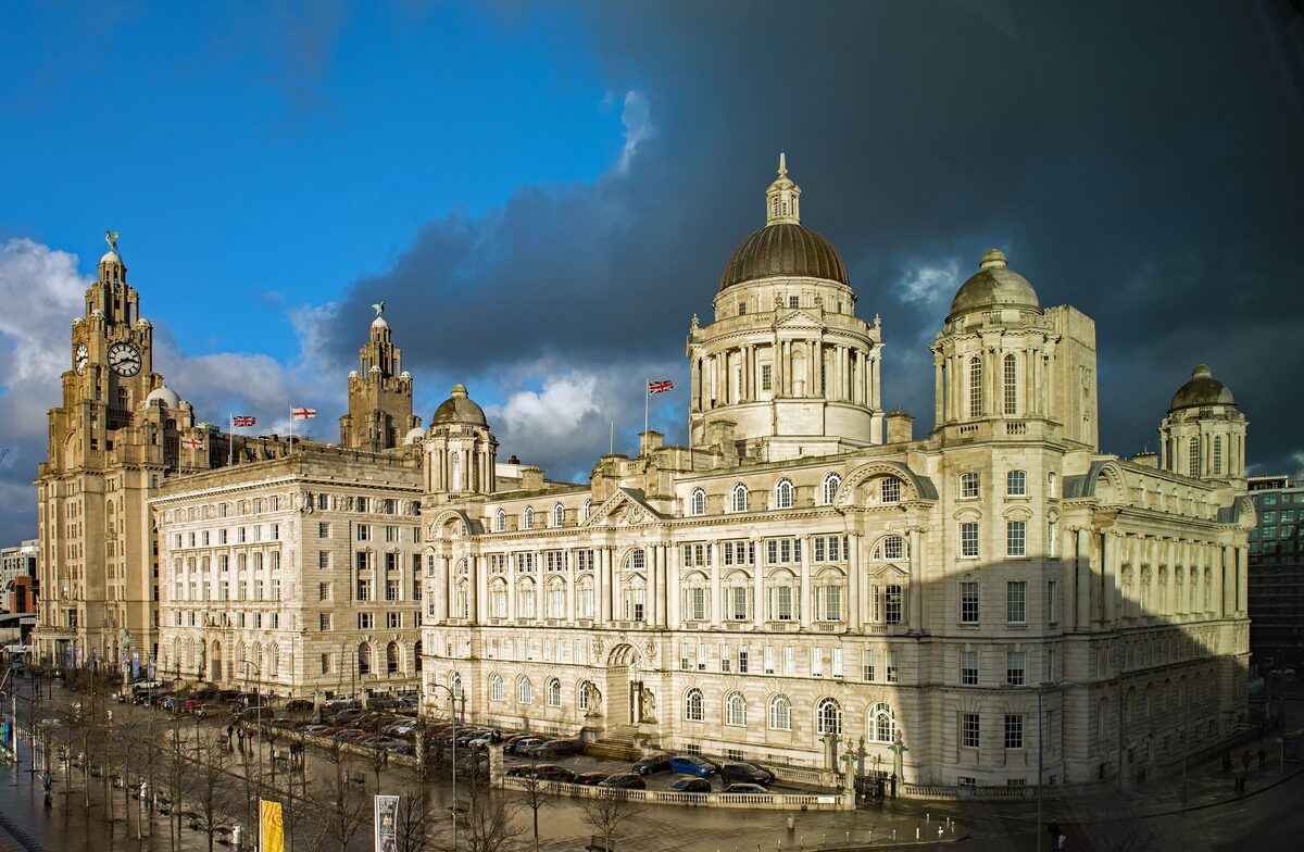 The Royal Liver Building with its two clock towers topped by Liver Birds, next to the Cunard Building, at Pier Head in Liverpool