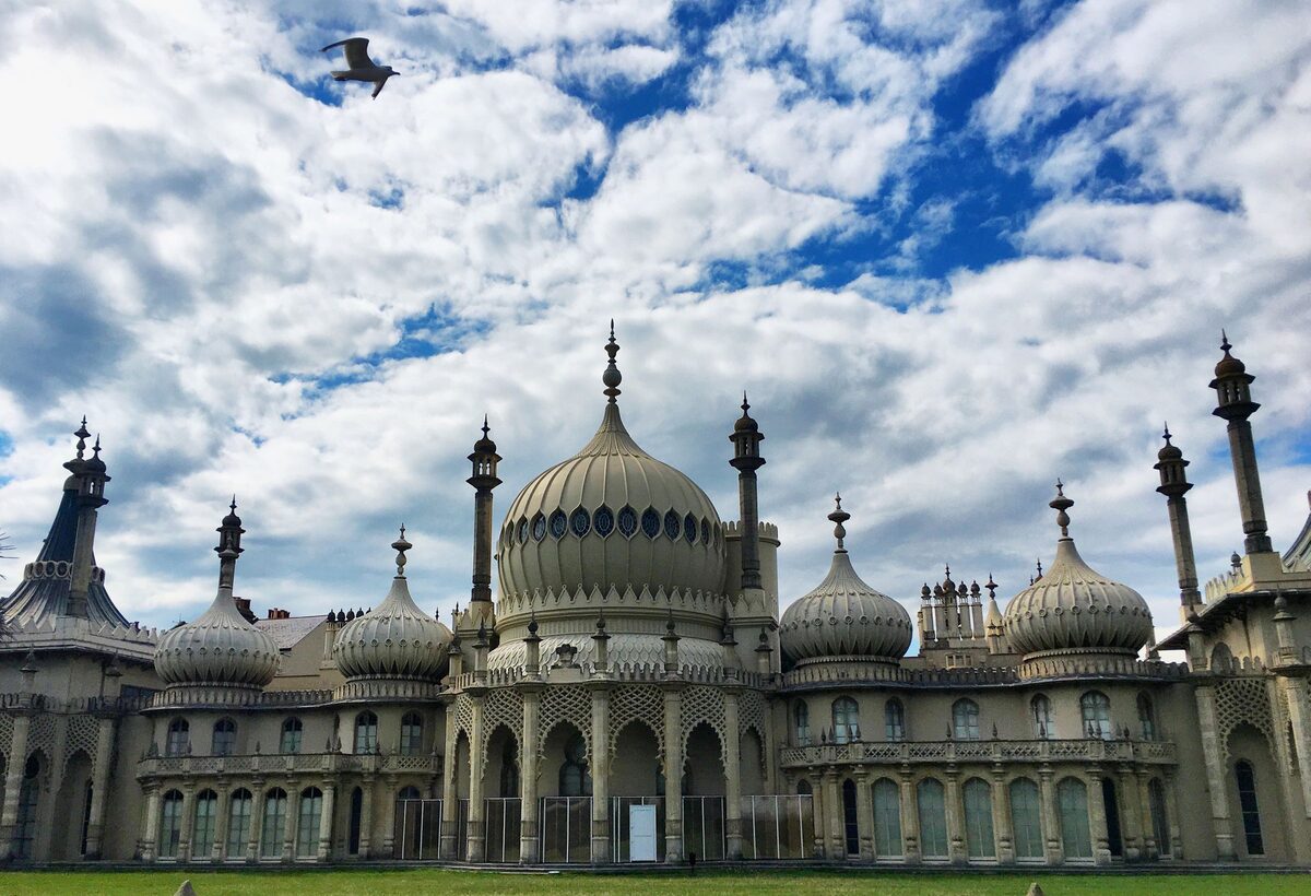 The Royal Pavilion in Brighton, with its onion domes and minarets under a cloudy sky