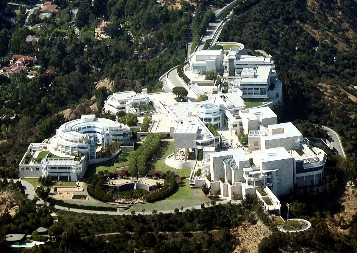 Aerial view of the white buildings and central garden of the Getty Center on its hilltop