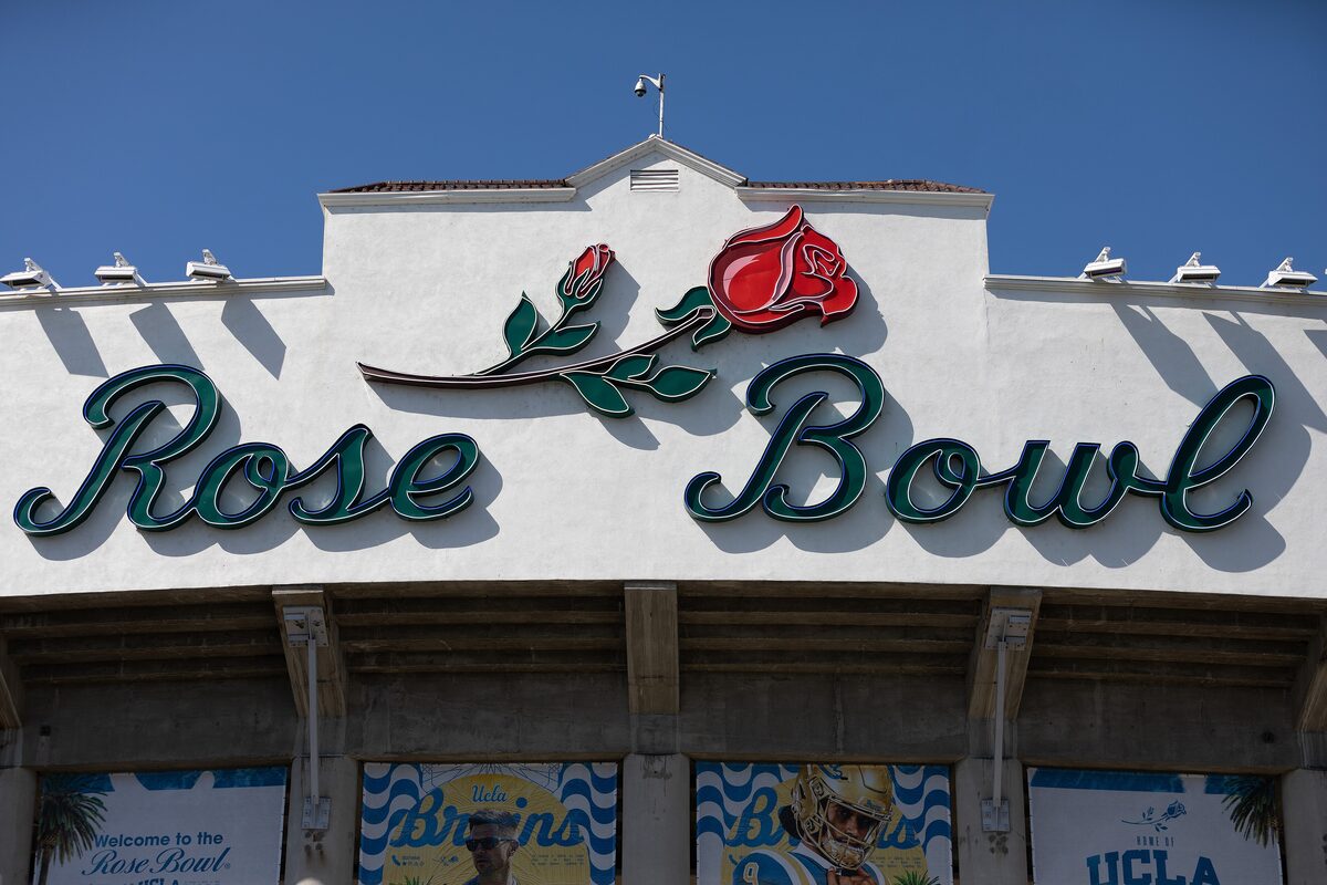 The Rose Bowl sign with its red rose above the stadium entrance in Pasadena