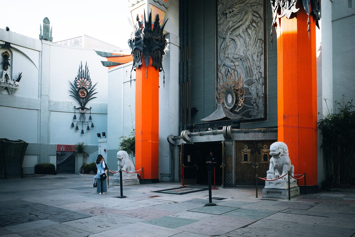The forecourt of the TCL Chinese Theatre with its orange pillars and stone lion guardians
