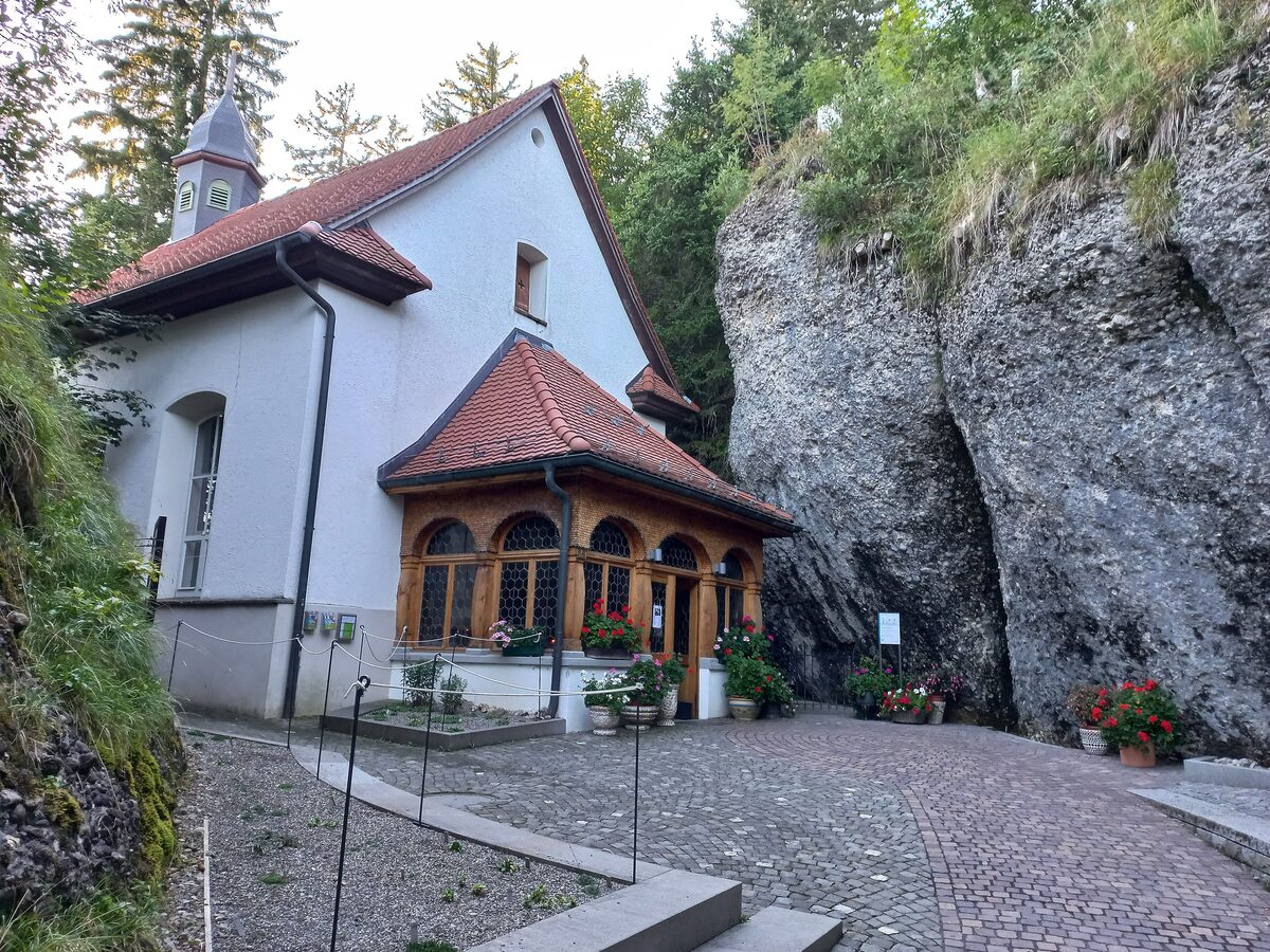 The rock chapel of St. Michael at Rigi Kaltbad, a white chapel built against a cliff