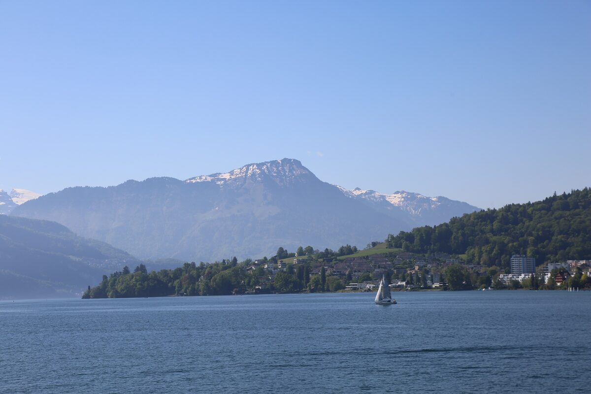 The Stanserhorn rising above the water of Lake Lucerne, with snow on its top
