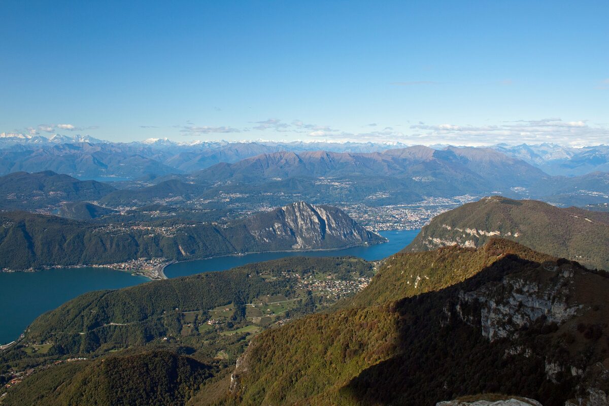 The view from the Monte Generoso summit over the lakes and valleys below, with the Alps on the horizon
