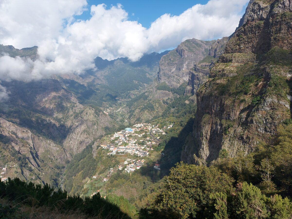 The village of Curral das Freiras in a deep valley ringed by cliffs and peaks